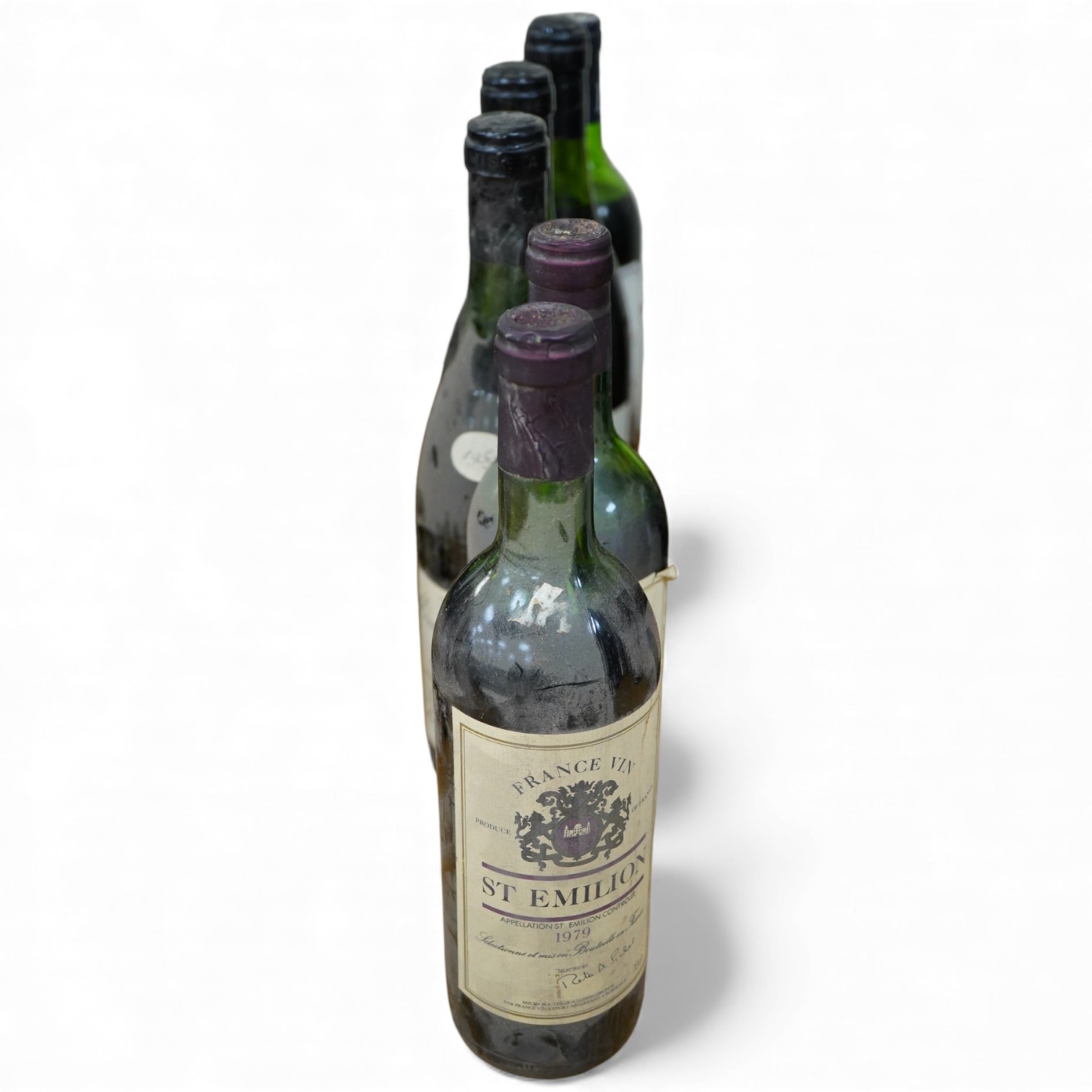 Six bottles of wine including three bottles of Moulin Touchais Anjou 1959, Prince Consort Costieres di Gard, two bottles of St. Emilion 1979, etc.